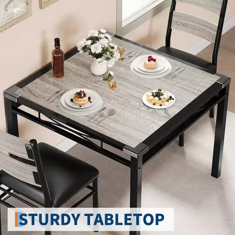 Ensemble de table à manger peu encombrant en MDF avec base en fer et chaises gigognes pour petite cuisine, appartement ou coin petit-déjeuner